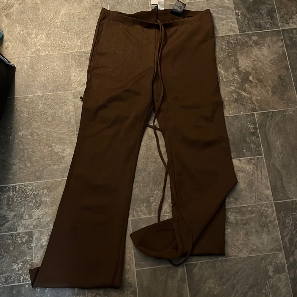 Glitter brow pants with flare and adjustable ties on waist